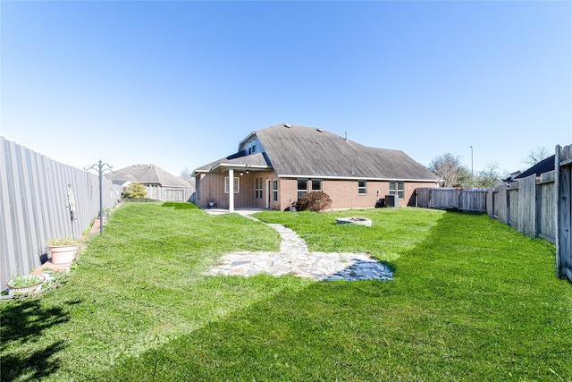 rear view of house with a lawn