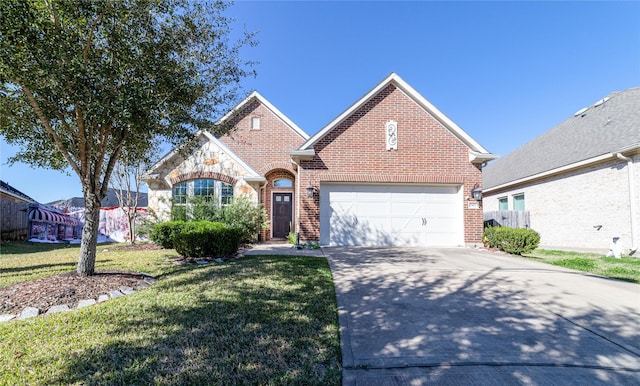 view of front property with a front yard and a garage