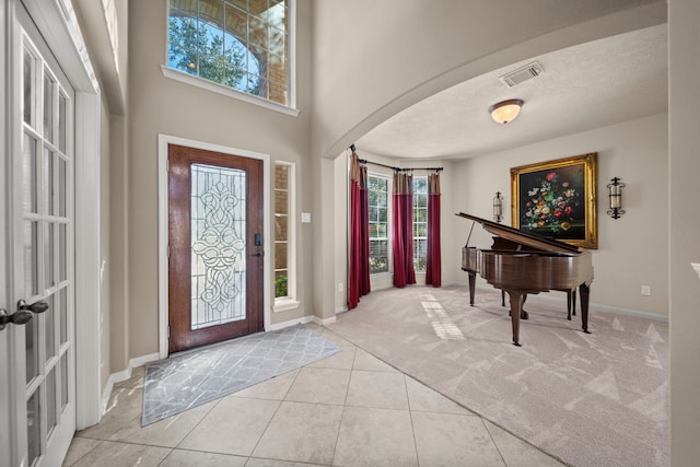 foyer featuring light tile patterned flooring