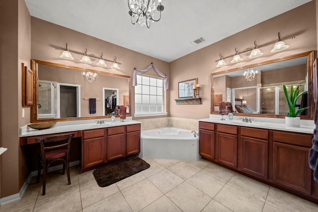 bathroom featuring tile patterned flooring, shower with separate bathtub, and vanity