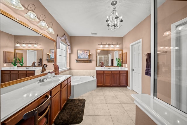 bathroom with tile patterned floors, plus walk in shower, vanity, and a chandelier