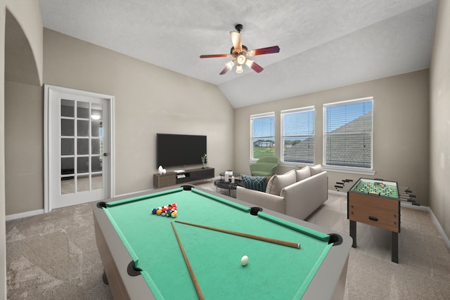 game room featuring a textured ceiling, light colored carpet, vaulted ceiling, ceiling fan, and billiards