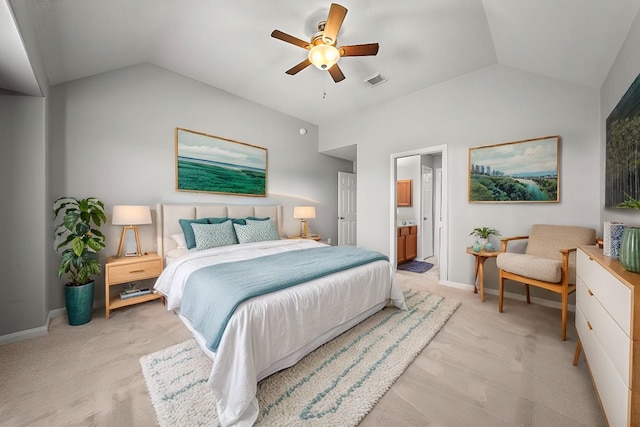 bedroom featuring ensuite bathroom, ceiling fan, and lofted ceiling