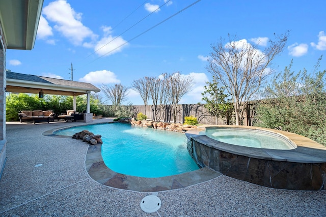 view of pool with pool water feature, an outdoor living space, an in ground hot tub, and a patio