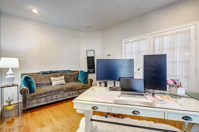 office area with light hardwood / wood-style flooring