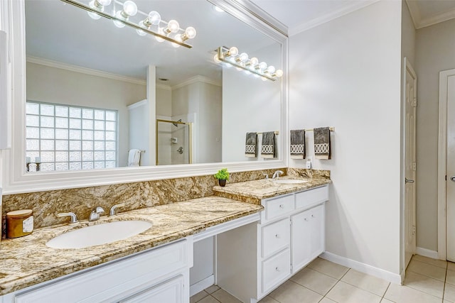 bathroom featuring tile patterned floors, vanity, an enclosed shower, and ornamental molding