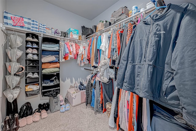 spacious closet with carpet flooring