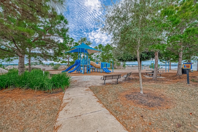 view of playground with a water view