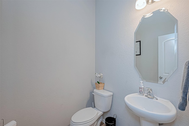 bathroom with sink and toilet