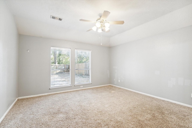 carpeted empty room featuring ceiling fan