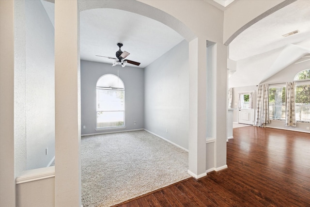 foyer featuring wood-type flooring, vaulted ceiling, and ceiling fan