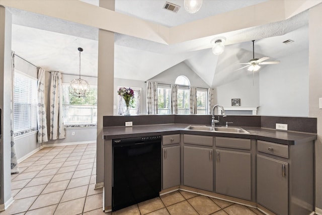 kitchen with ceiling fan with notable chandelier, sink, dishwasher, lofted ceiling, and light tile patterned flooring