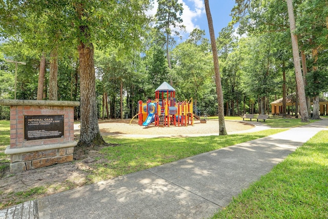 view of jungle gym with a lawn