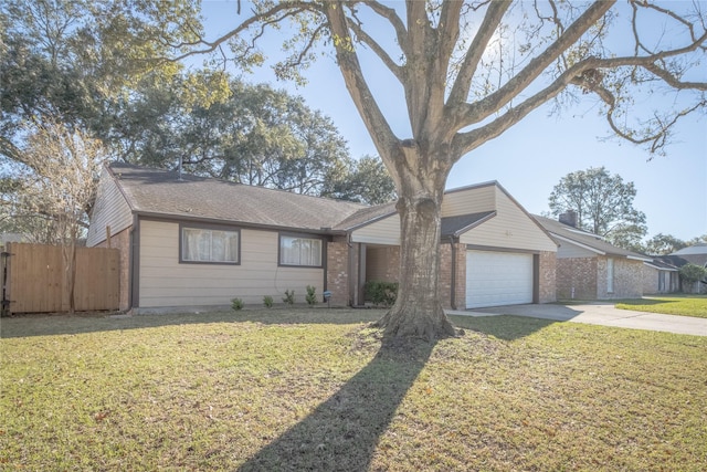 single story home featuring a garage and a front lawn