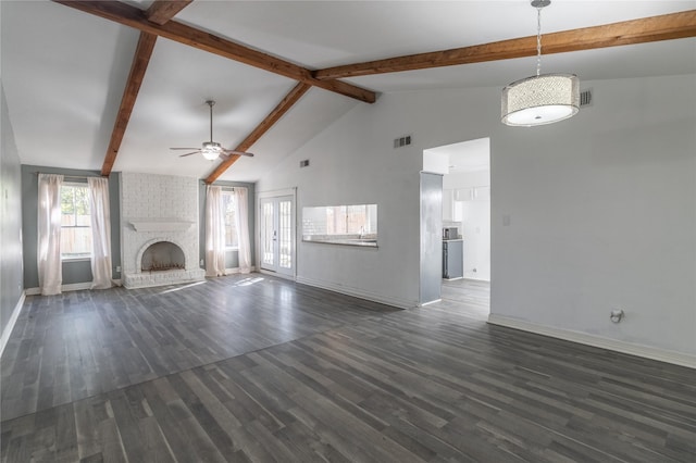 unfurnished living room featuring dark wood-type flooring, high vaulted ceiling, a brick fireplace, ceiling fan, and beam ceiling