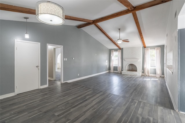 unfurnished living room featuring dark hardwood / wood-style flooring, ceiling fan, a fireplace, and vaulted ceiling