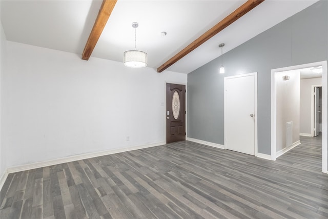 interior space with dark wood-type flooring and lofted ceiling with beams