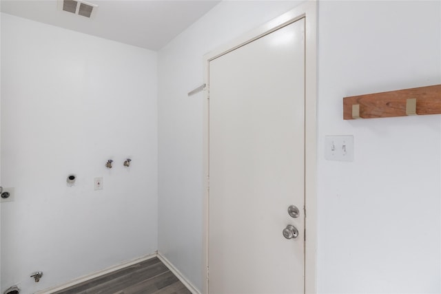 laundry area featuring washer hookup, dark wood-type flooring, and electric dryer hookup