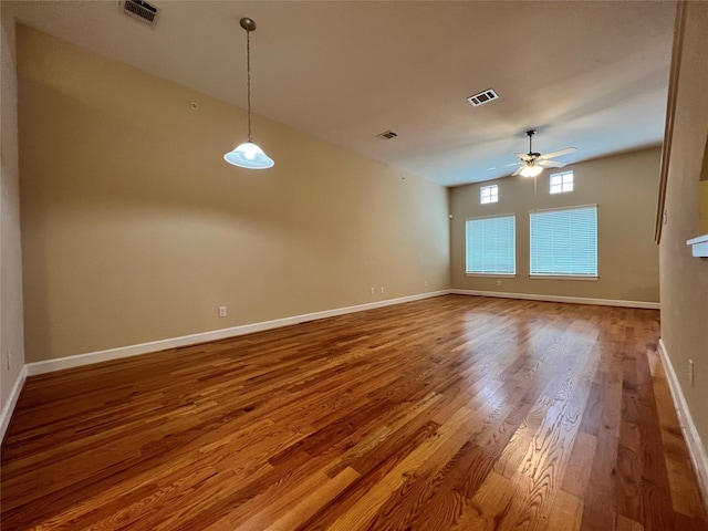 unfurnished room featuring ceiling fan and hardwood / wood-style floors