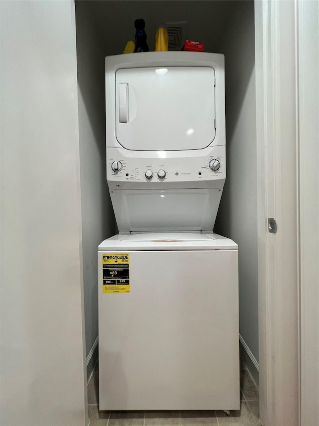 laundry area featuring stacked washer and dryer