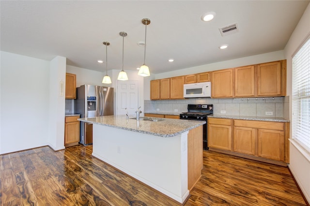 kitchen with a kitchen island with sink, black range, sink, stainless steel fridge, and dark hardwood / wood-style flooring