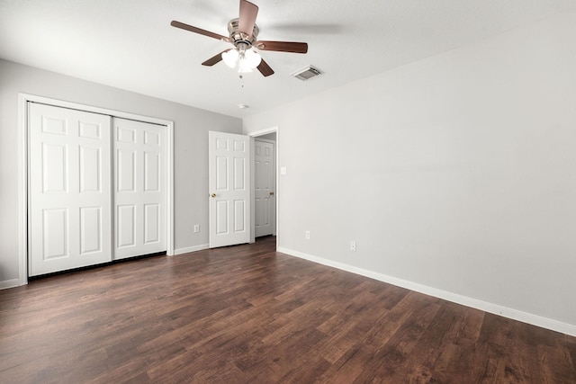 unfurnished bedroom with dark hardwood / wood-style floors and ceiling fan