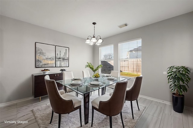 dining room featuring a notable chandelier