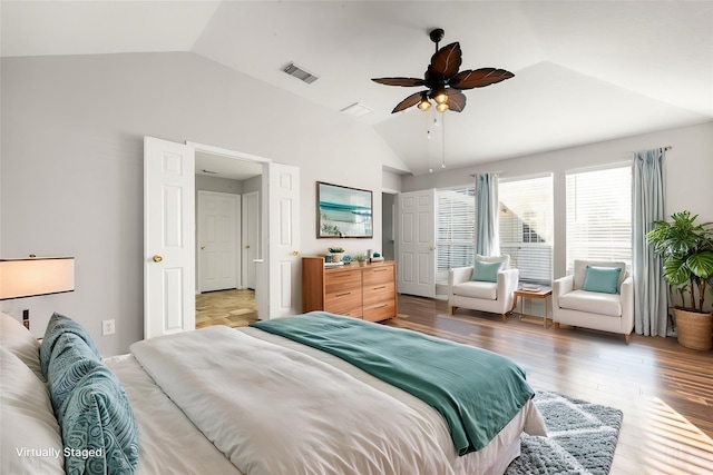 bedroom featuring hardwood / wood-style floors, ceiling fan, and vaulted ceiling