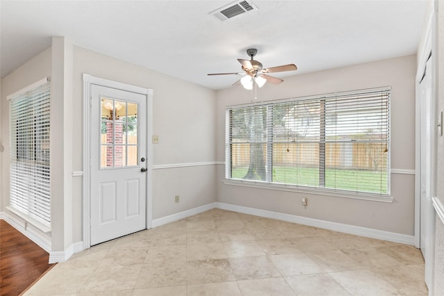 entryway with plenty of natural light and ceiling fan