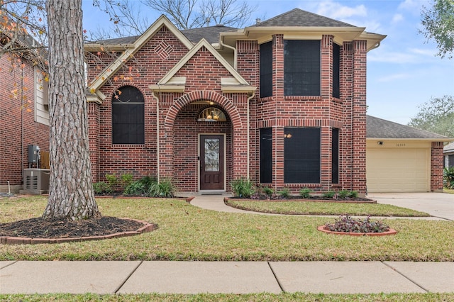 view of front of home with a front yard and a garage