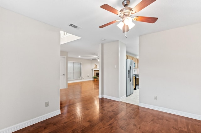 unfurnished room with ceiling fan and light hardwood / wood-style floors