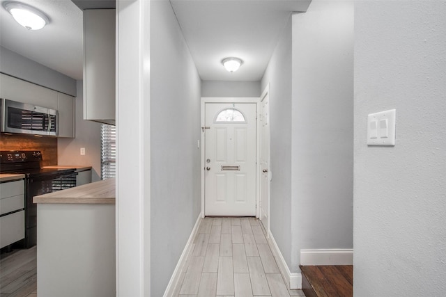 doorway to outside with light hardwood / wood-style flooring