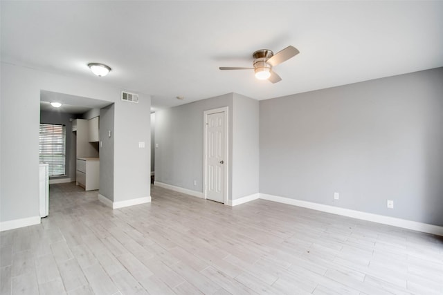 unfurnished living room featuring ceiling fan and light hardwood / wood-style flooring