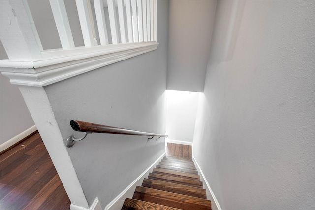 staircase featuring hardwood / wood-style floors