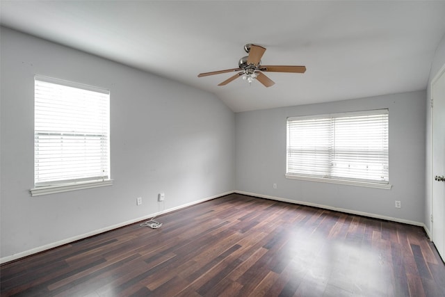 spare room featuring ceiling fan, dark hardwood / wood-style flooring, and lofted ceiling