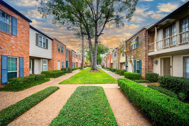 surrounding community featuring a lawn