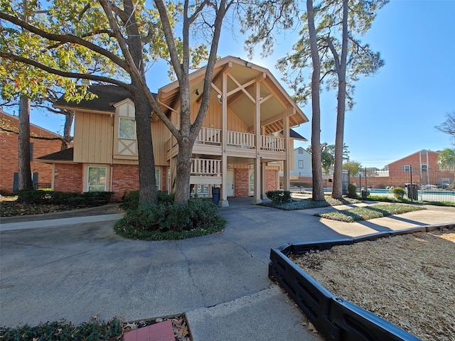 view of front of house with a balcony