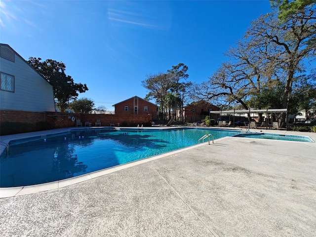 view of pool featuring a patio