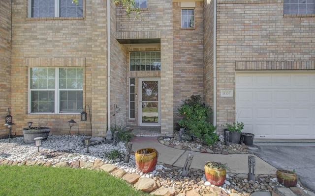 view of exterior entry with a garage