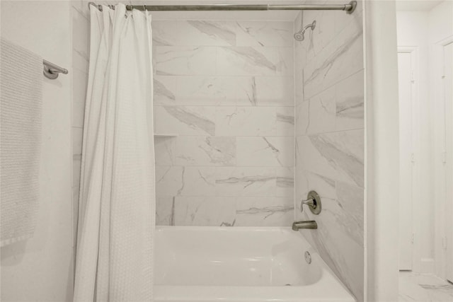 bathroom featuring shower / bath combo with shower curtain