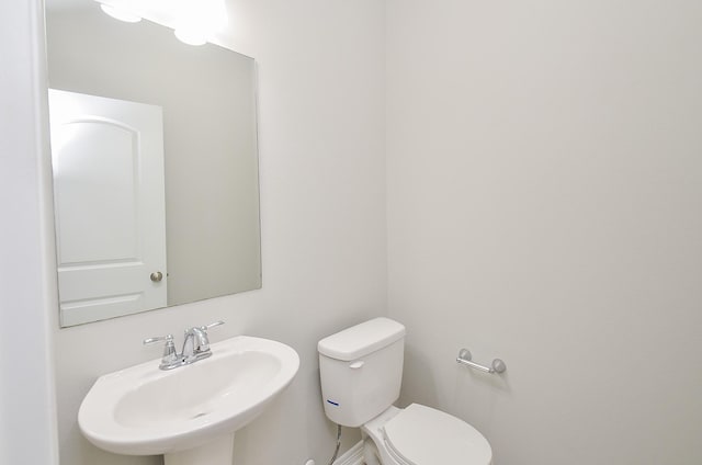 bathroom with a sink and toilet