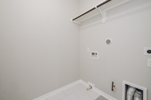 laundry area featuring gas dryer hookup, hookup for an electric dryer, laundry area, washer hookup, and baseboards