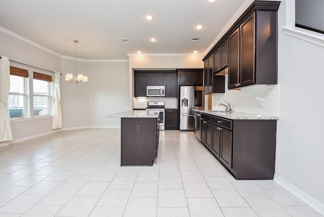 kitchen featuring light tile patterned floors, dark brown cabinets, stainless steel appliances, and backsplash