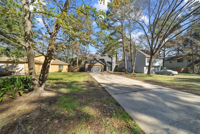 view of front of home featuring a garage and a front yard