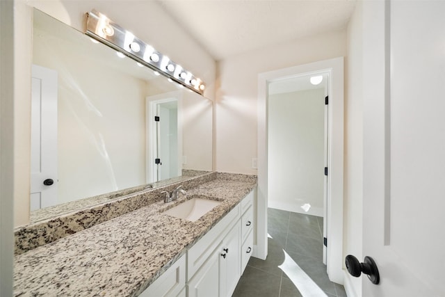 bathroom with vanity and tile patterned floors