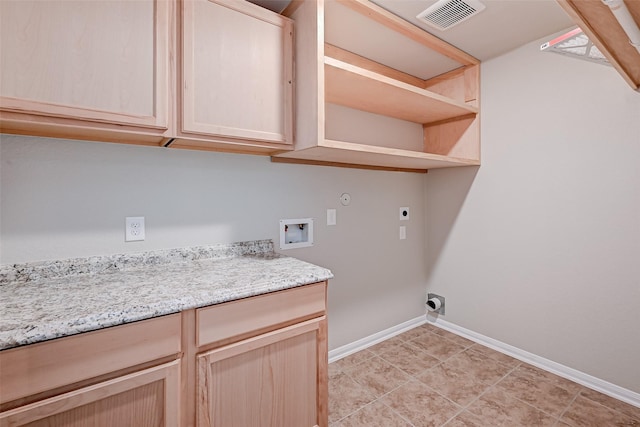 washroom with electric dryer hookup, cabinets, washer hookup, and hookup for a gas dryer