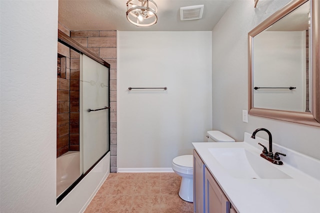 full bathroom featuring toilet, combined bath / shower with glass door, and vanity