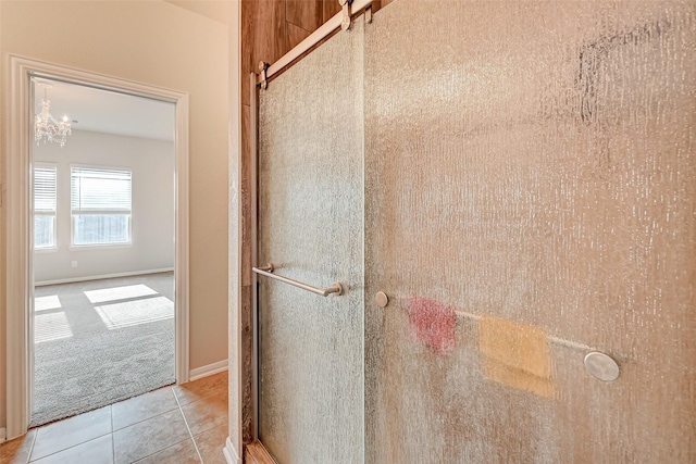 bathroom featuring tile patterned floors and walk in shower