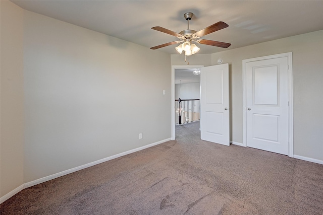 unfurnished bedroom featuring carpet and ceiling fan