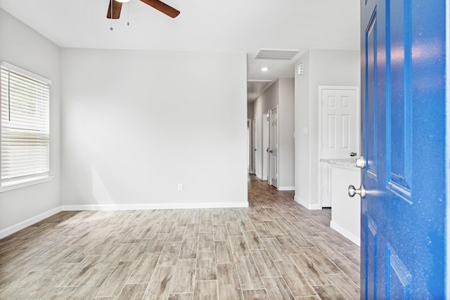 4649 Carmen St, Houston, TX 77051 - empty room featuring ceiling fan, light wood-type flooring, and baseboards